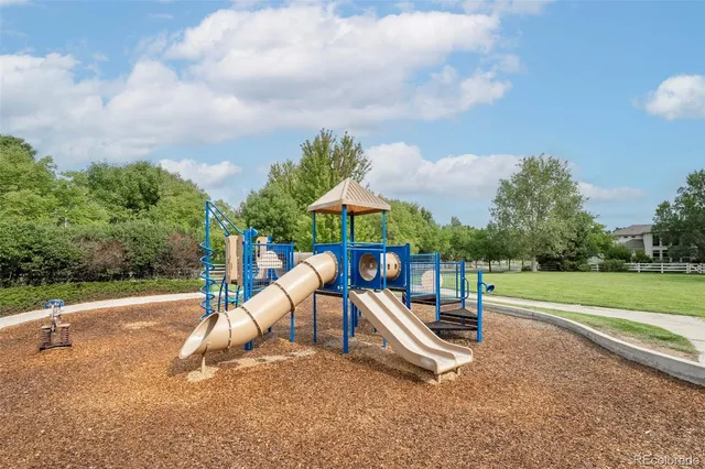 an aerial view of a house with a yard lake view and mountain view