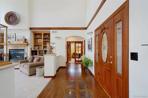 a living room with furniture fireplace and flat screen tv