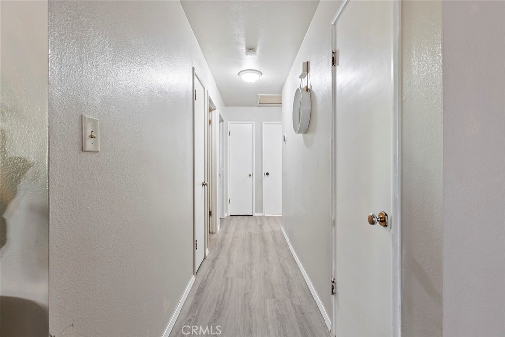 1510 High Street Atwater, CA 95301 - Photo 12 of 27 a view of a hallway with wooden floor