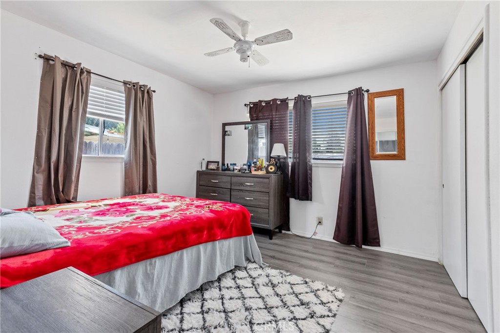 1510 High Street Atwater, CA 95301 - Photo 15 of 27 a bedroom with a bed and a dresser with wooden floor