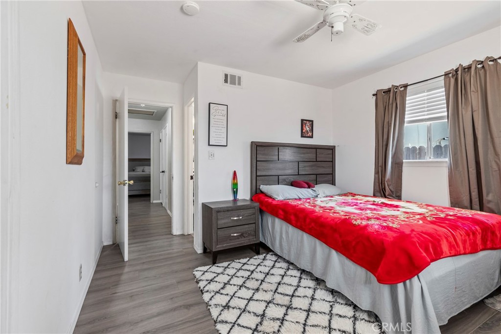 1510 High Street Atwater, CA 95301 - Photo 16 of 27 a bedroom with bed and a chandelier