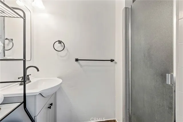 a bathroom with a sink and mirror
