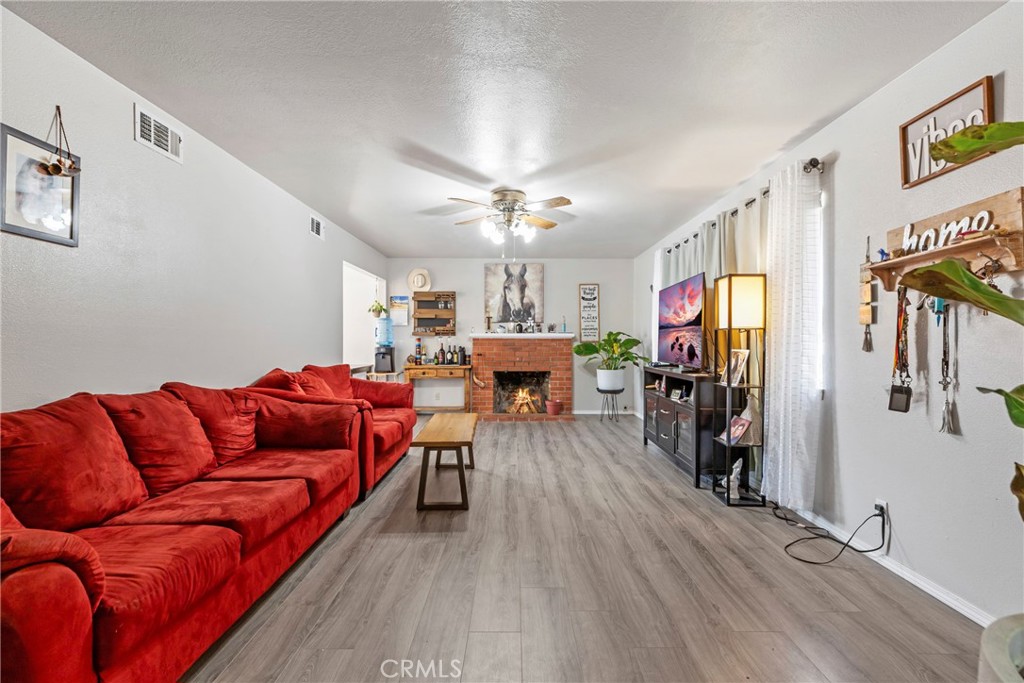 1510 High Street Atwater, CA 95301 - Photo 5 of 27 a living room with furniture kitchen view and a chandelier