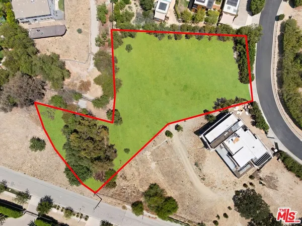 an aerial view of a house with a garden