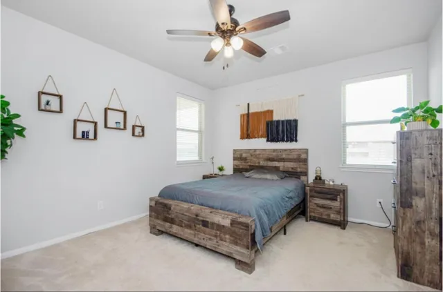 a spacious bathroom with a double vanity sink mirror and shower