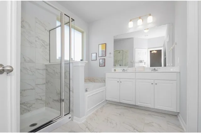 a bathroom with a bathtub and a sink