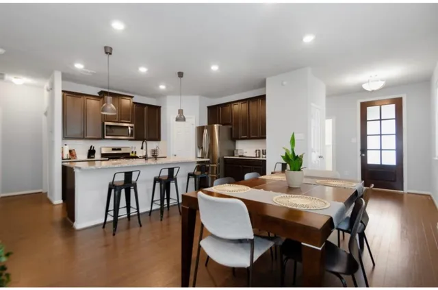 a kitchen with cabinets a sink and appliances