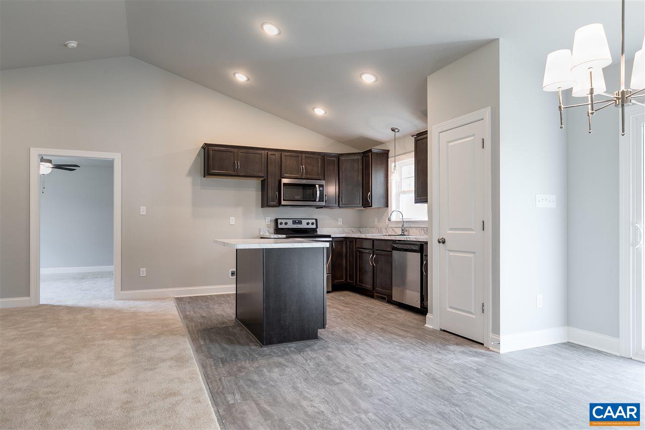 2581 Bumpass Road Beaverdam, VA 23015 - Photo 5 of 16 a kitchen with stainless steel appliances granite countertop a refrigerator sink and microwave