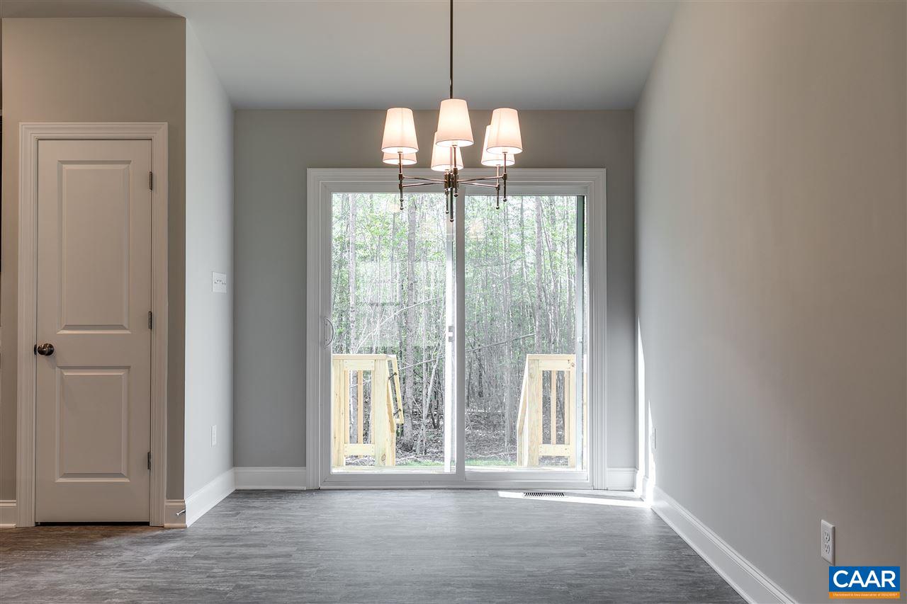 2581 Bumpass Road Beaverdam, VA 23015 - Photo 6 of 16 a view of a room with wooden floor and chandelier