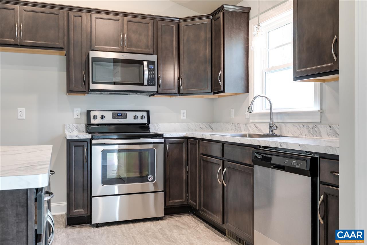 2581 Bumpass Road Beaverdam, VA 23015 - Photo 7 of 16 a kitchen with a sink stove and microwave