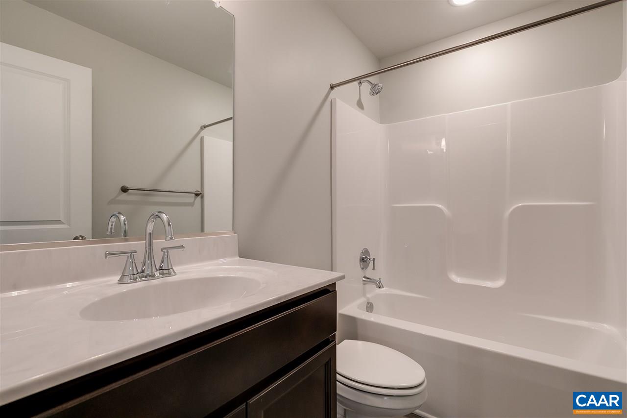 2581 Bumpass Road Beaverdam, VA 23015 - Photo 10 of 16 a bathroom with a sink a toilet and a bathtub