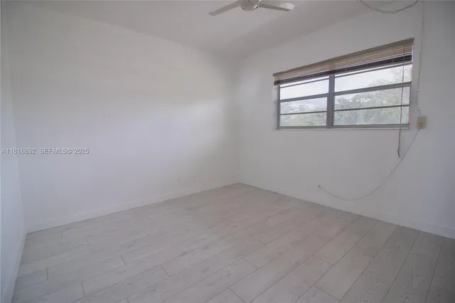 an empty room that has a window