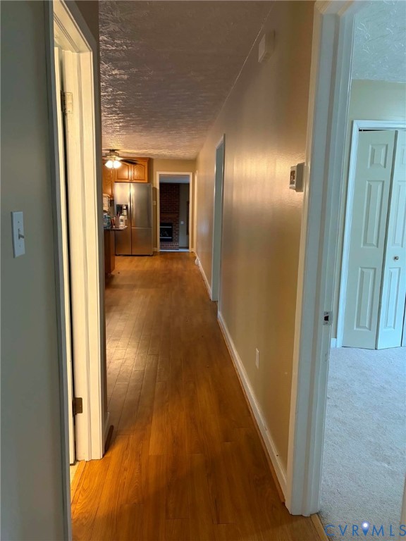 3766 Venter Road Aylett, VA 23009 - Photo 10 of 28 Hallway with wood-finish flooring extending to a k