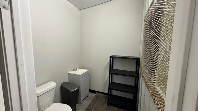 a bathroom with a toilet and a sink