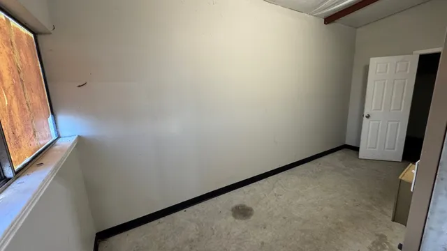 a view of a hallway with a window