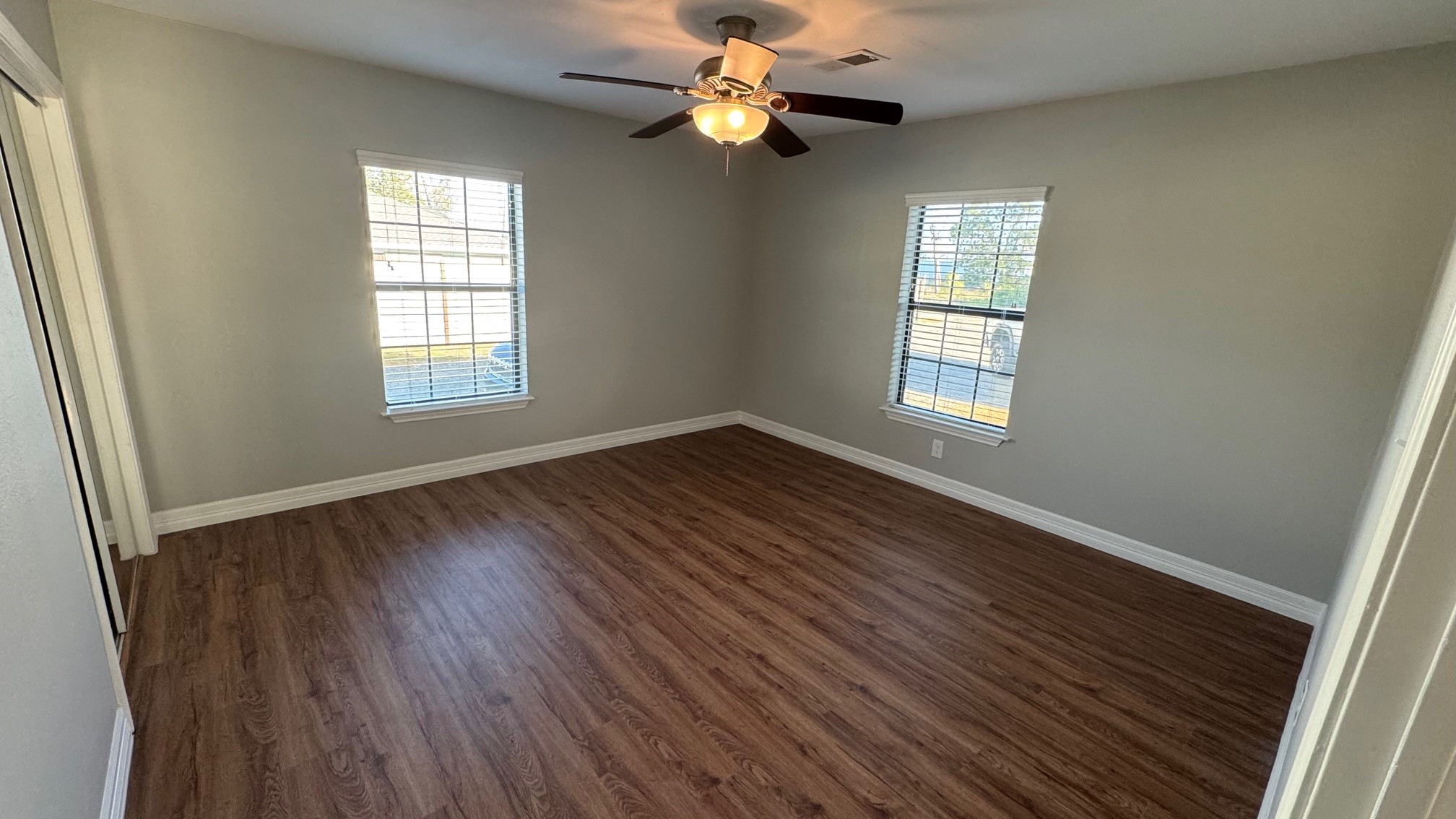 16811 Avenue A Channelview, TX 77530 - Photo 6 of 14 a view of an empty room with wooden floor and a window