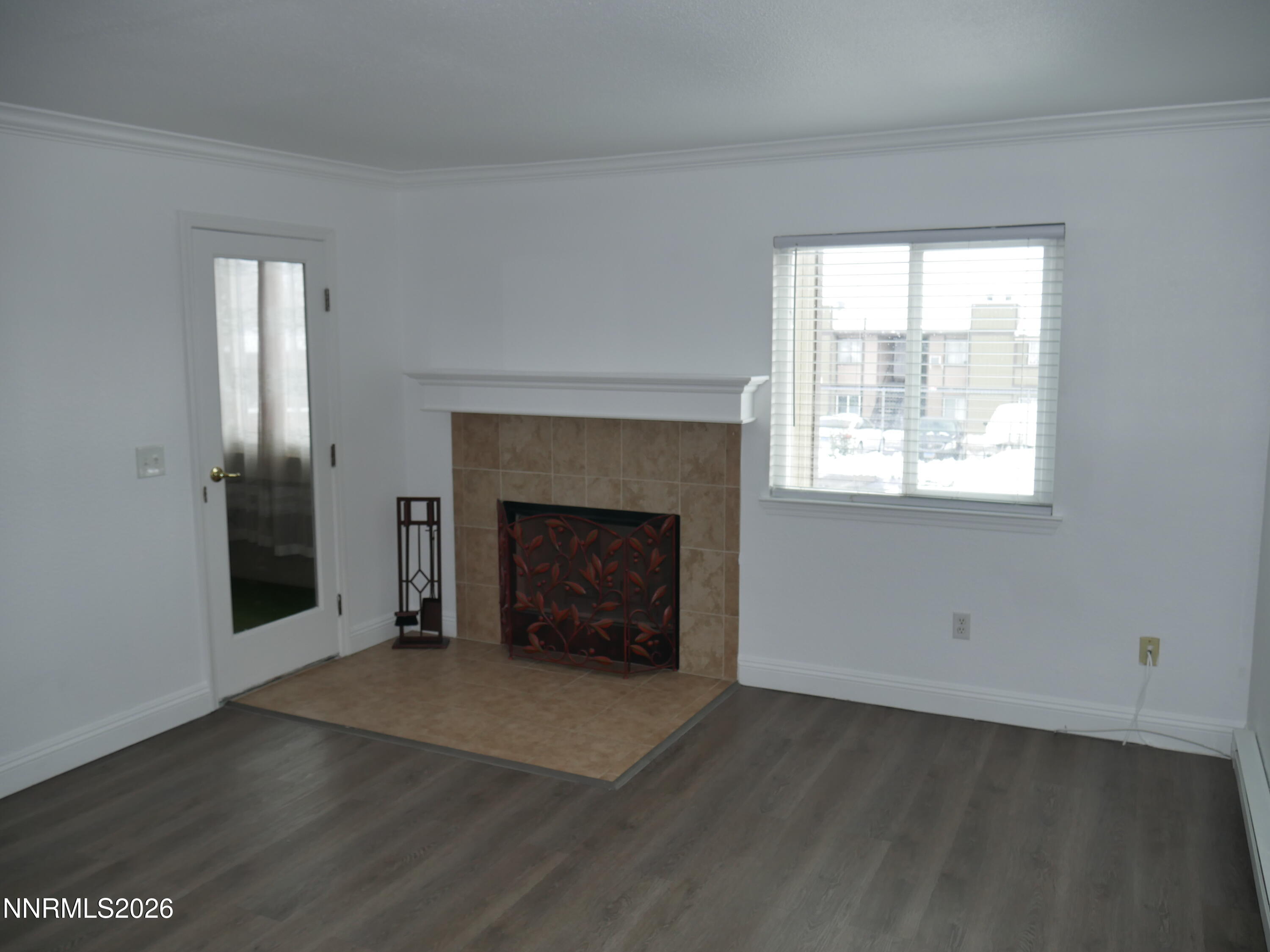 2385 Tripp Drive, Unit 3 Reno, NV 89512 - Photo 14 of 49 a view of an empty room with a window and fireplace