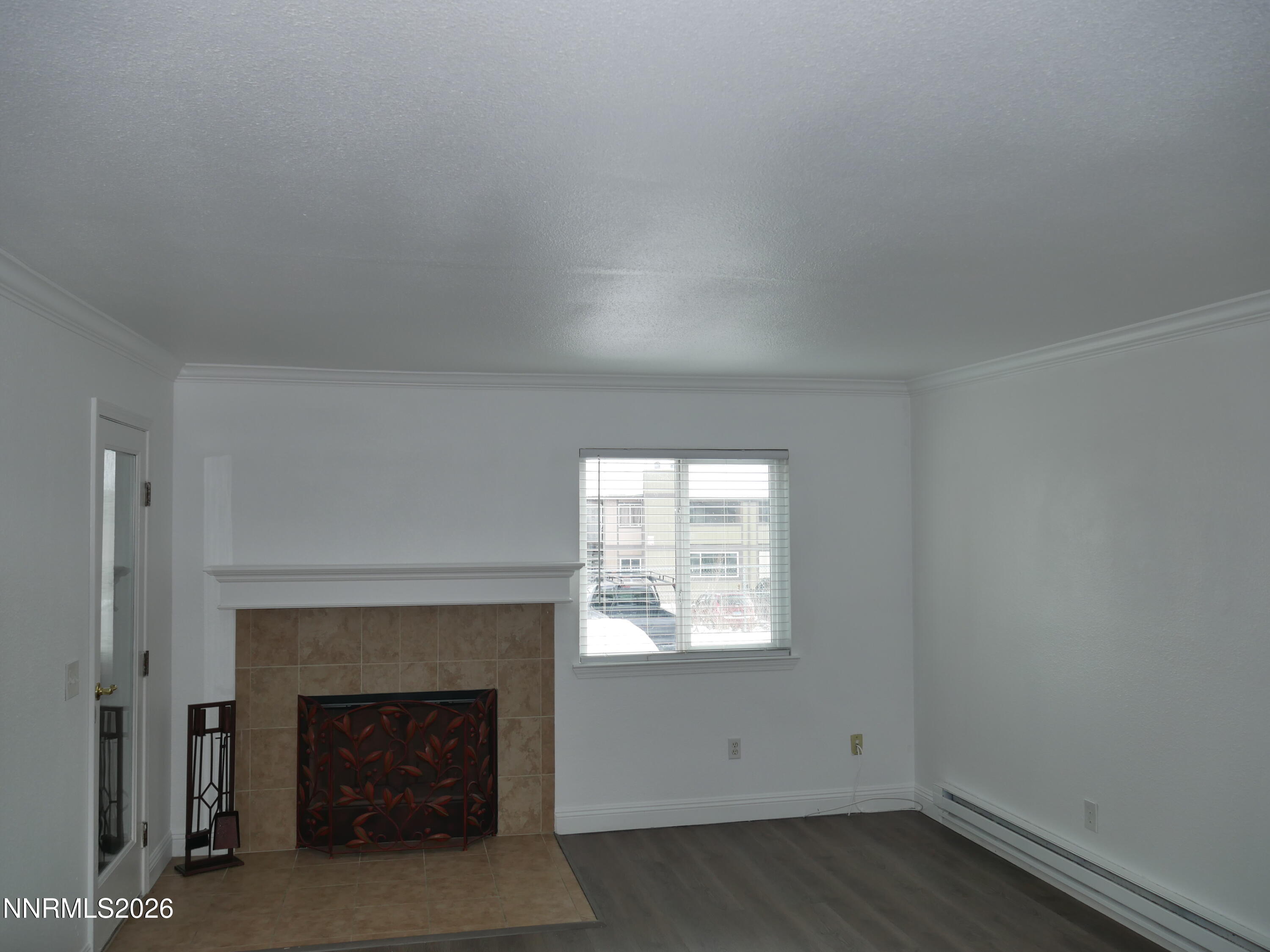 2385 Tripp Drive, Unit 3 Reno, NV 89512 - Photo 15 of 49 an empty room with a fireplace