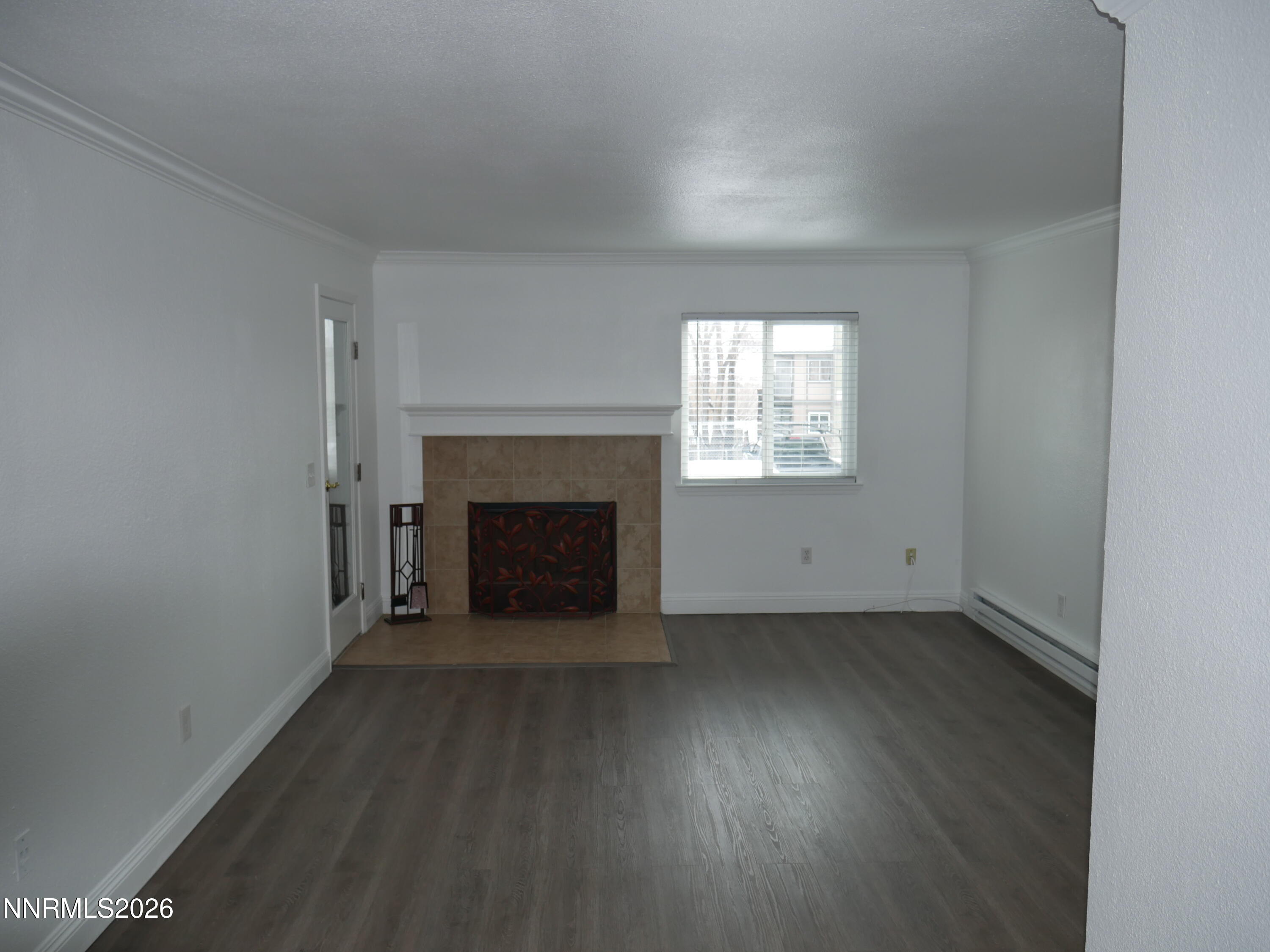 2385 Tripp Drive, Unit 3 Reno, NV 89512 - Photo 16 of 49 an empty room with windows and fireplace