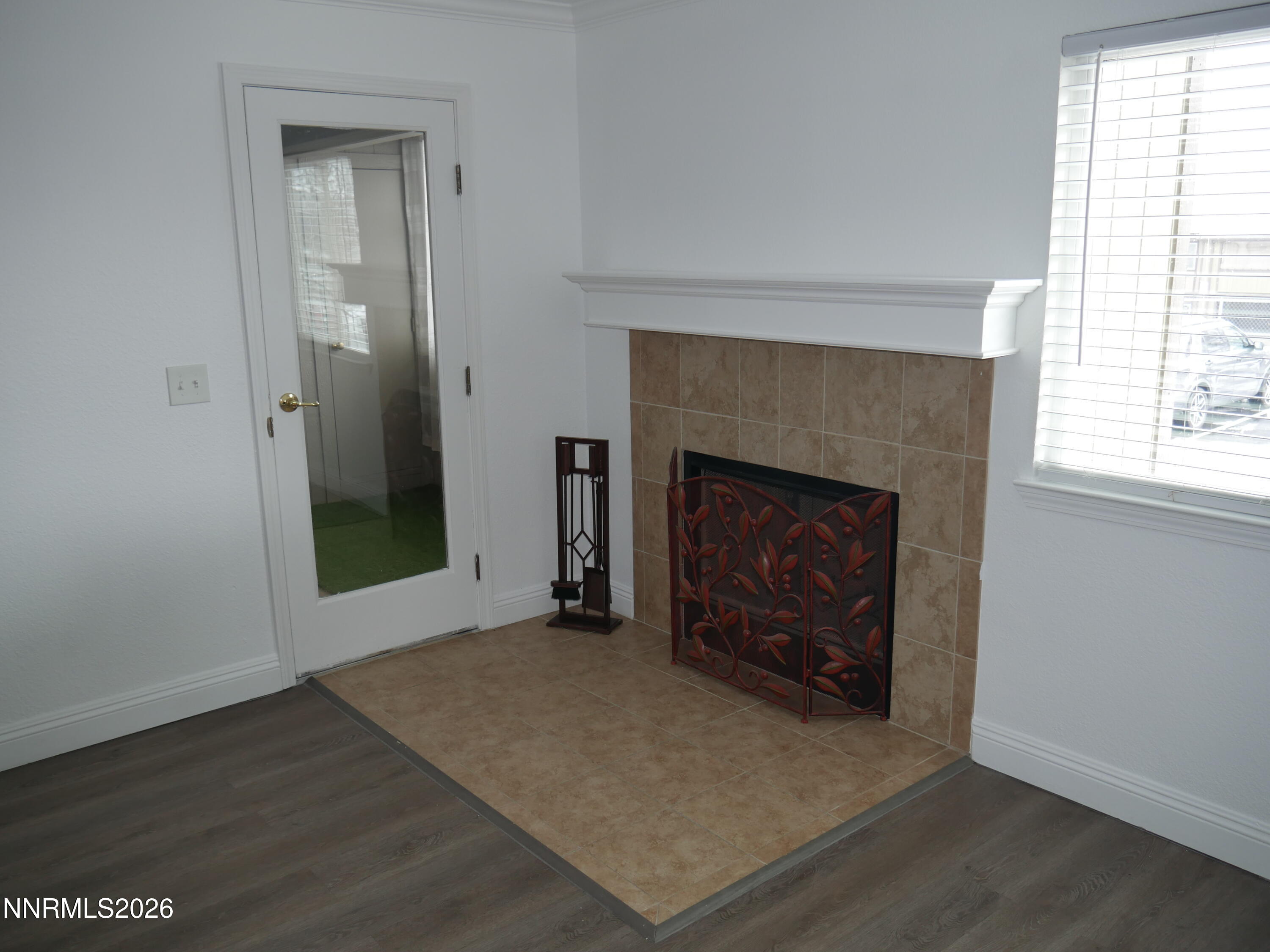 2385 Tripp Drive, Unit 3 Reno, NV 89512 - Photo 18 of 49 an empty room with windows and fireplace