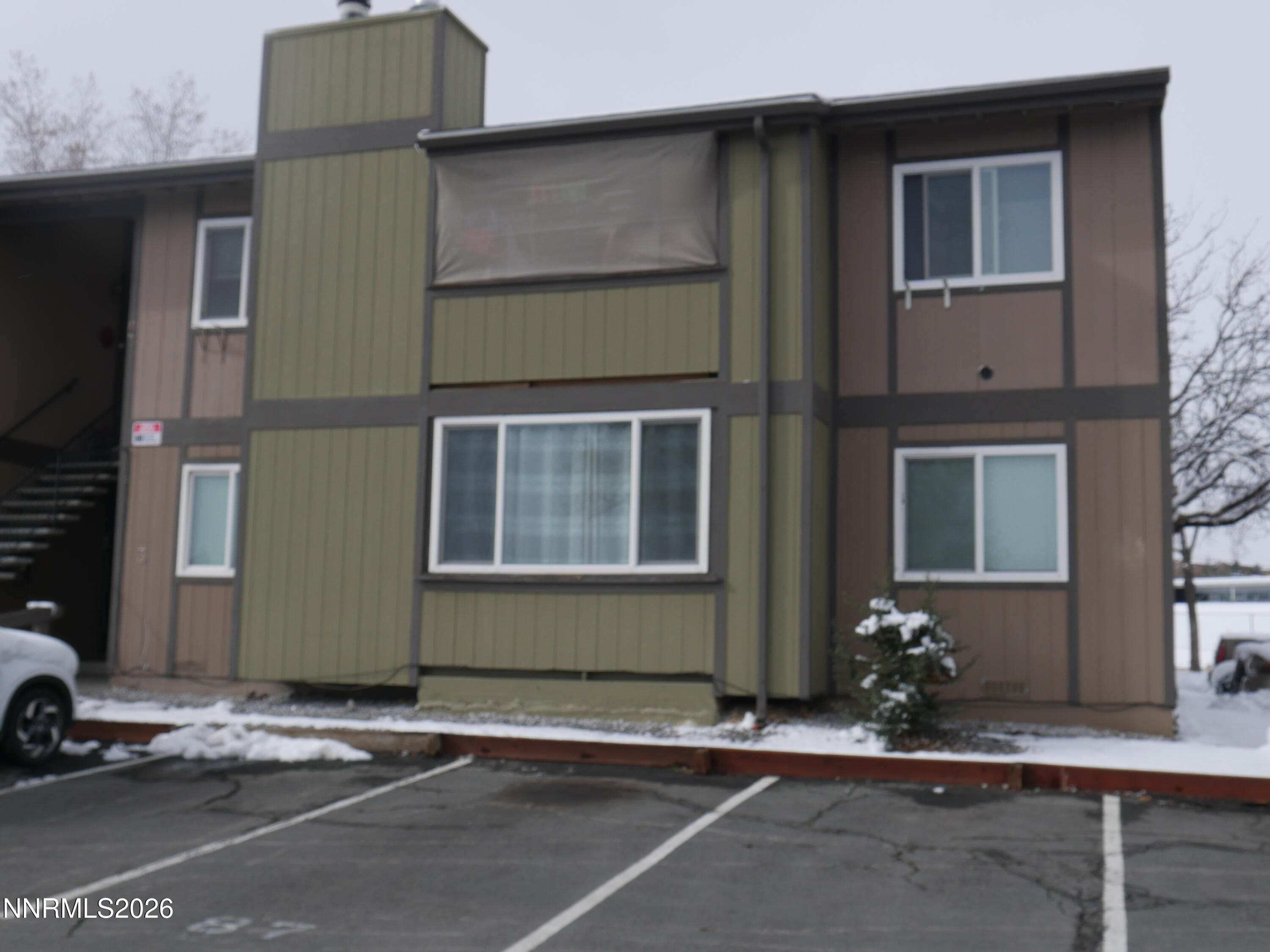 2385 Tripp Drive, Unit 3 Reno, NV 89512 - Photo 2 of 49 a front view of a house with a yard and garage