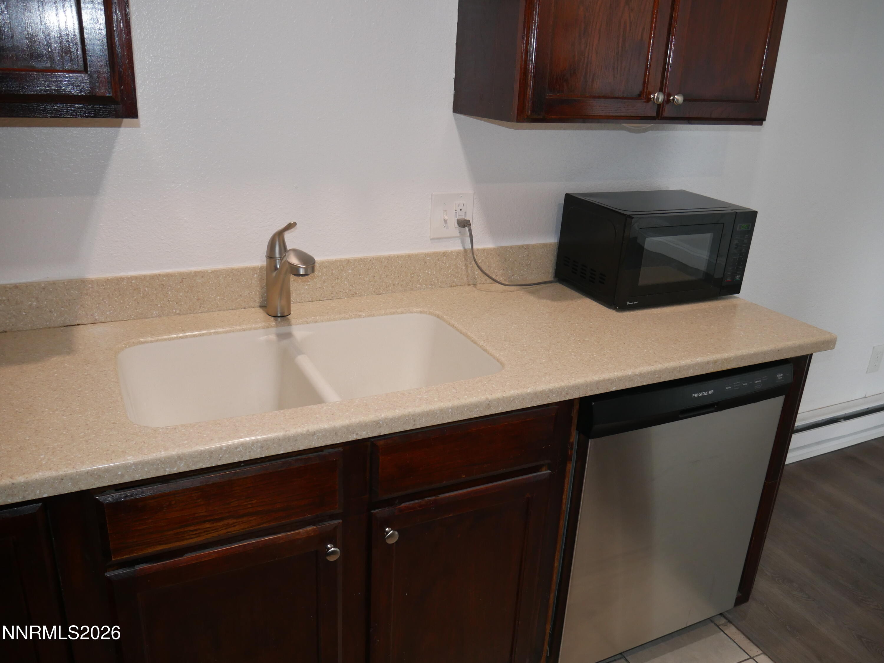 2385 Tripp Drive, Unit 3 Reno, NV 89512 - Photo 26 of 49 a kitchen with a sink and cabinets