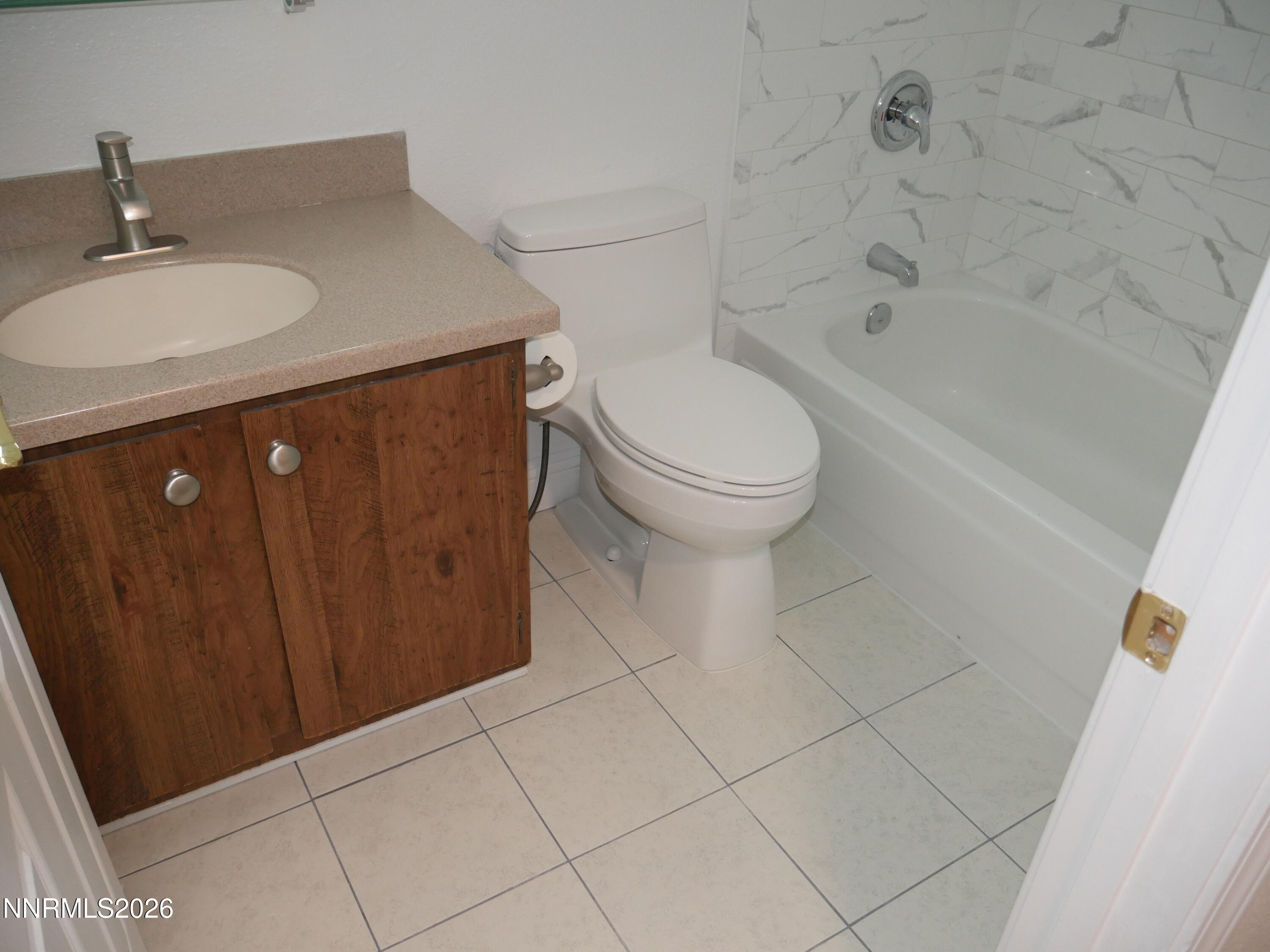 2385 Tripp Drive, Unit 3 Reno, NV 89512 - Photo 30 of 49 a bathroom with a sink a toilet and bathtub