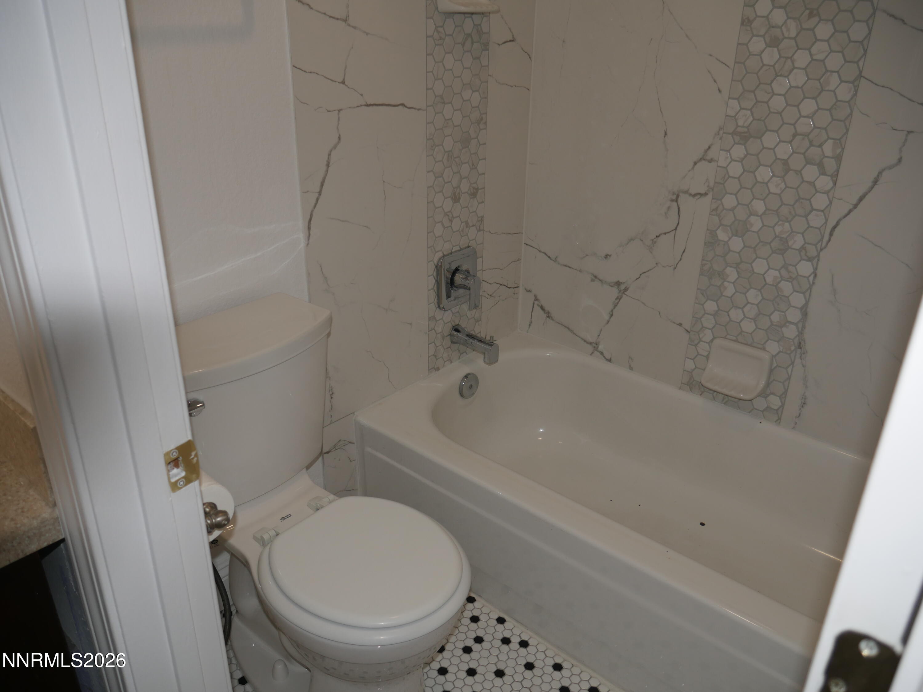 2385 Tripp Drive, Unit 3 Reno, NV 89512 - Photo 39 of 49 a bathroom with a bathtub and a toilet