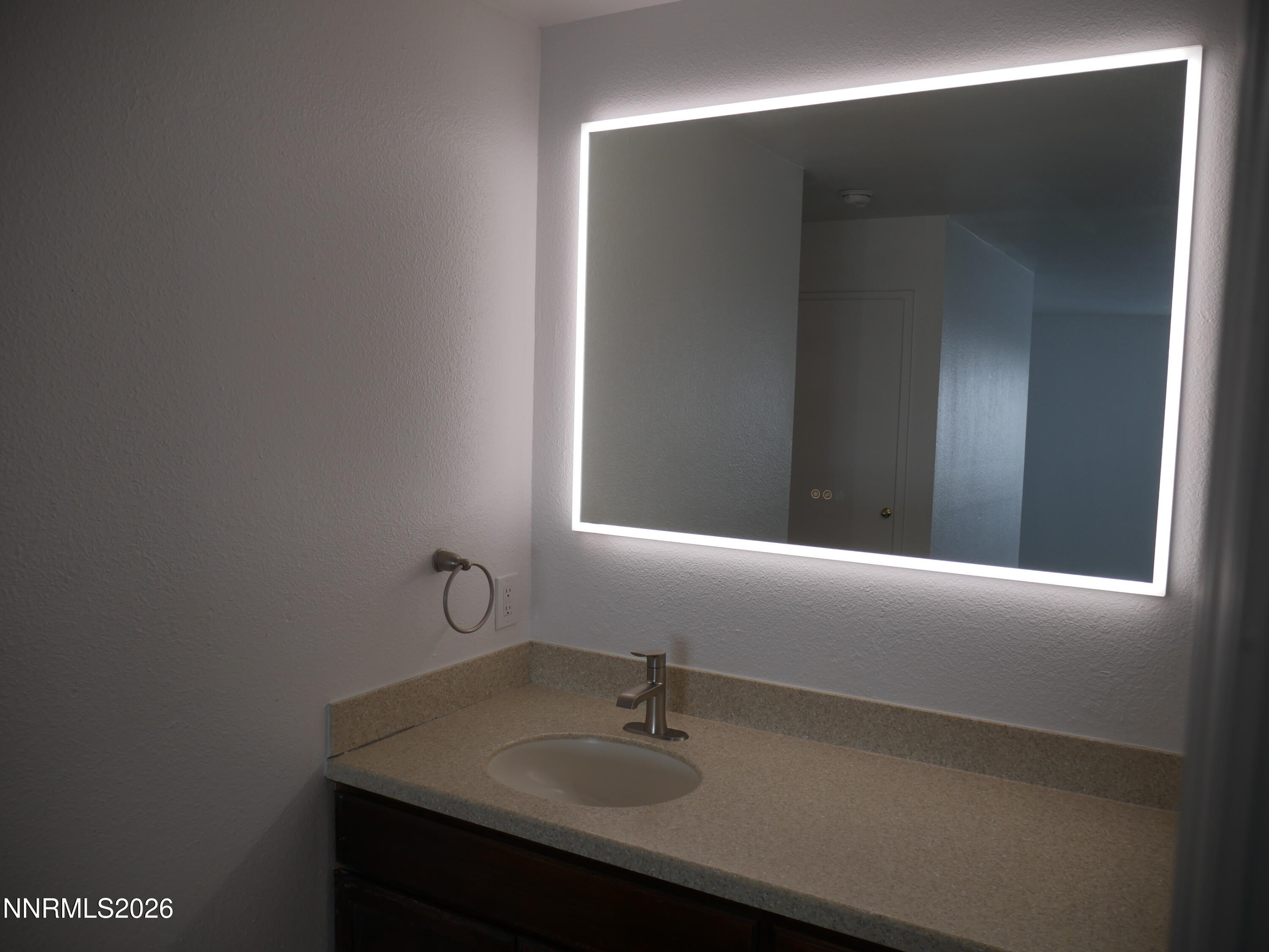 2385 Tripp Drive, Unit 3 Reno, NV 89512 - Photo 40 of 49 a bathroom with a sink and a mirror