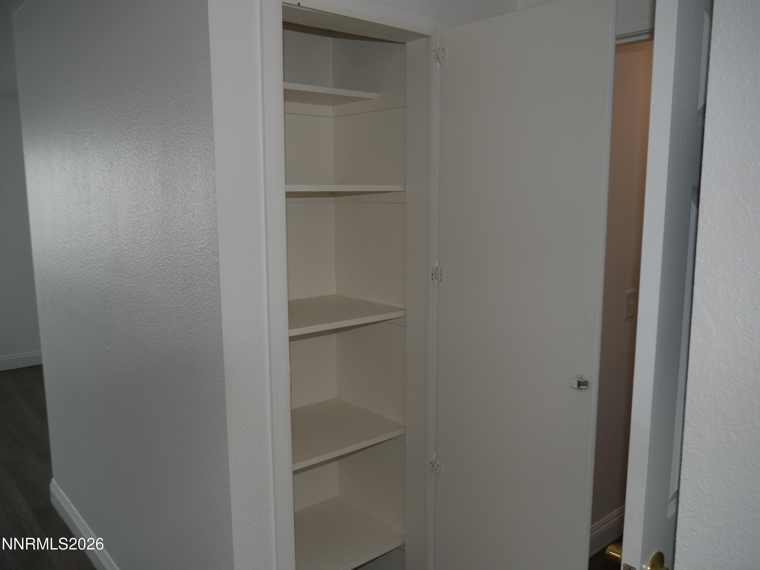 2385 Tripp Drive, Unit 3 Reno, NV 89512 - Photo 43 of 49 a view of walk in closet with empty racks