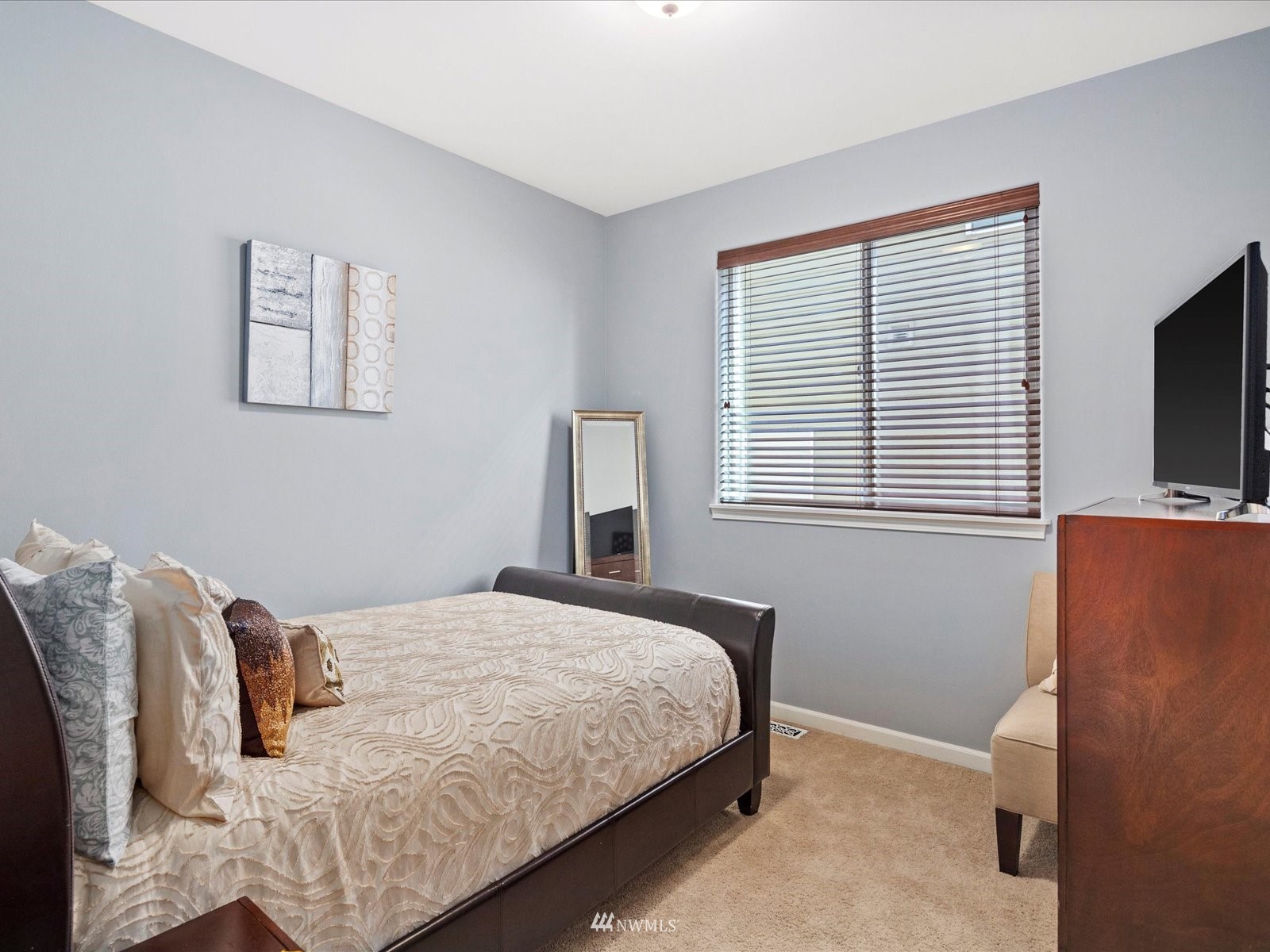 1705 235th Place Southwest Bothell, WA 98021 - Photo 17 of 35 a bedroom with a bed and a flat screen tv