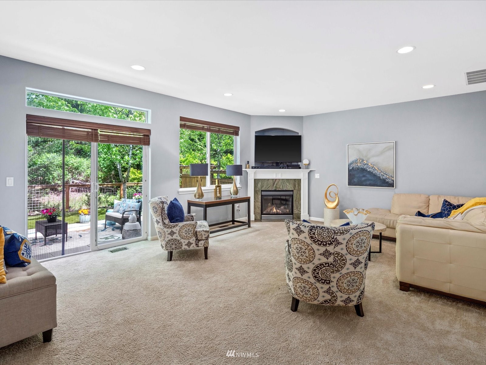 1705 235th Place Southwest Bothell, WA 98021 - Photo 2 of 35 a living room with furniture a fireplace and a flat screen tv