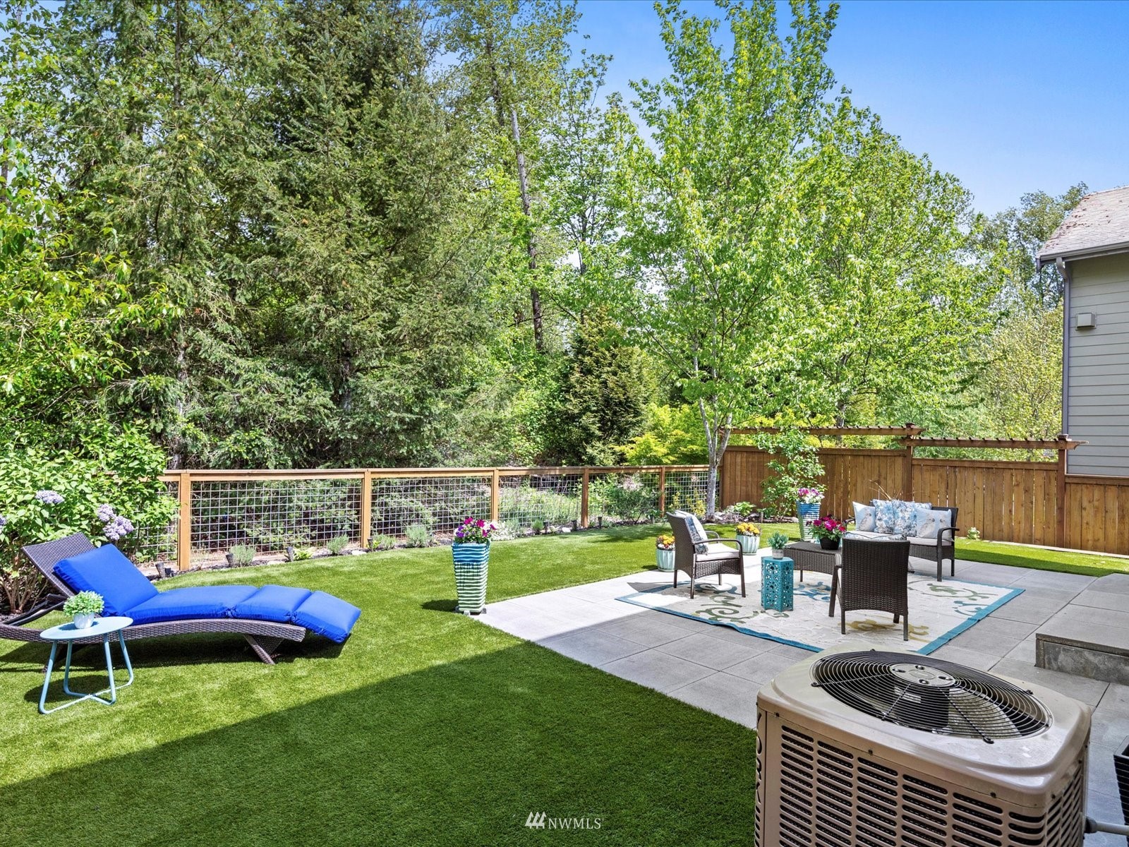 1705 235th Place Southwest Bothell, WA 98021 - Photo 30 of 35 a view of a swimming pool with chairs and a fire pit