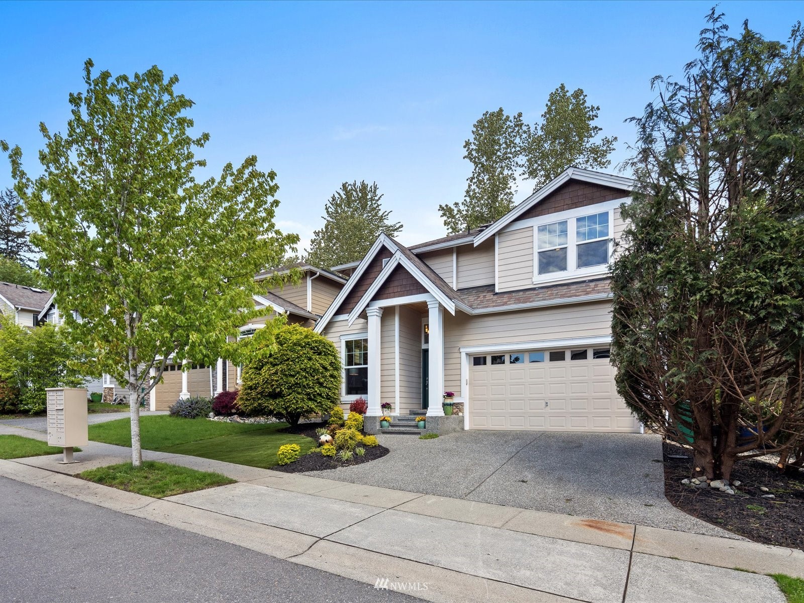 1705 235th Place Southwest Bothell, WA 98021 - Photo 32 of 35 a front view of a house with garden