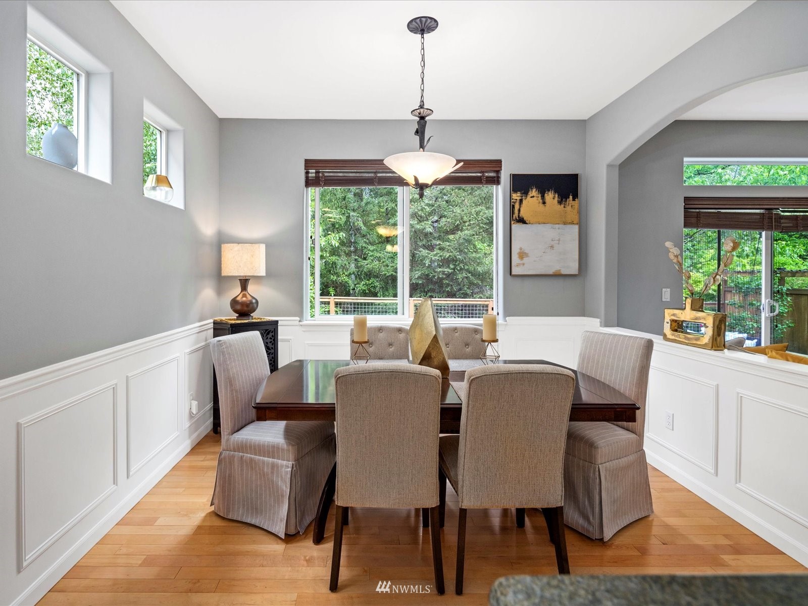 1705 235th Place Southwest Bothell, WA 98021 - Photo 10 of 35 a dining room with furniture a chandelier and wooden floor