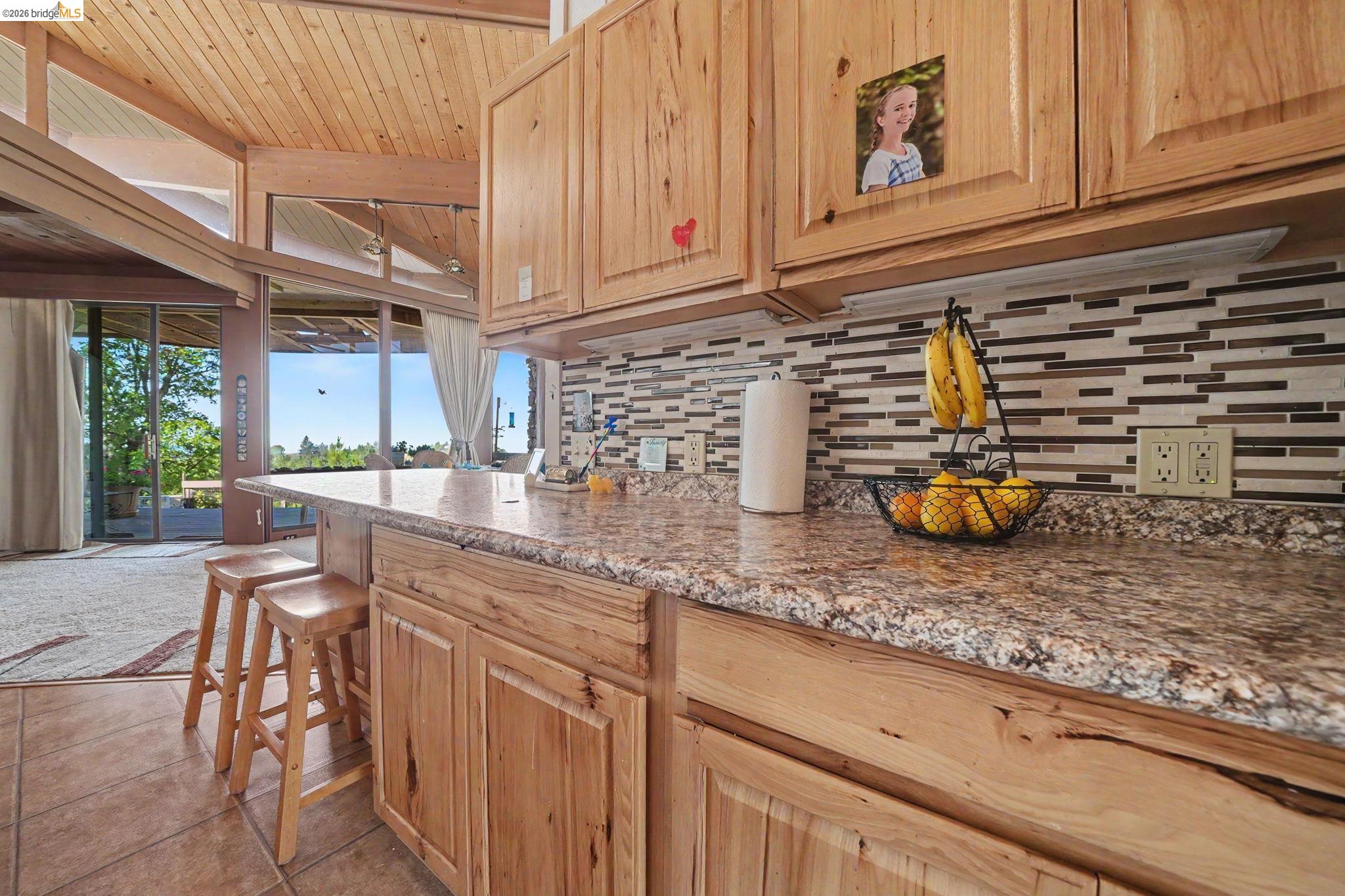 6161 Fullen Road Murphys, CA 95247 - Photo 32 of 53 a kitchen with stainless steel appliances granite countertop a sink a stove and cabinets