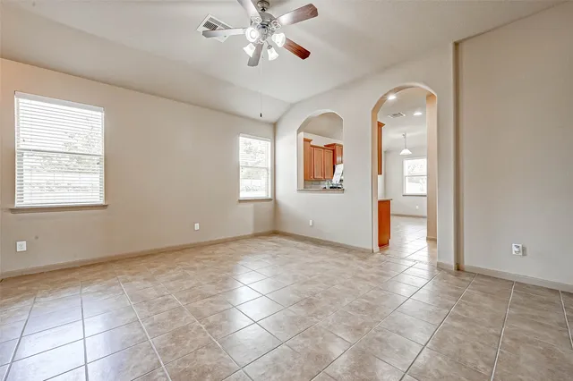 a view of an empty room with a window