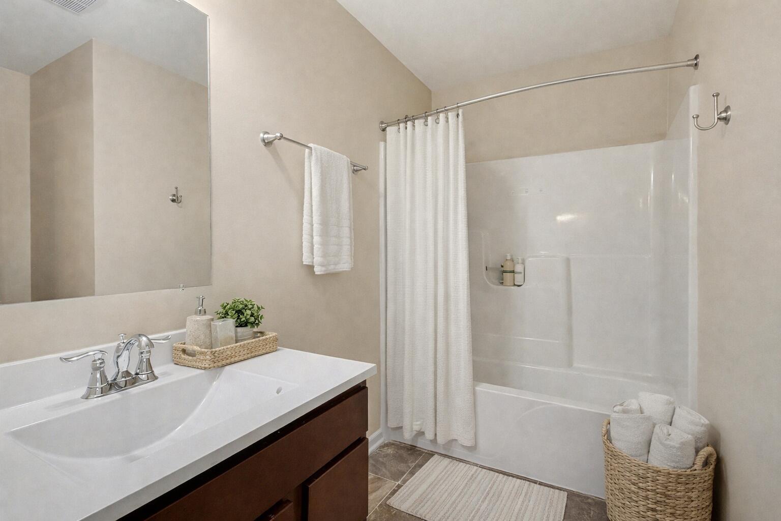 1063 East 116th Place Crown Point, IN 46307 - Photo 22 of 24 a bathroom with a sink a toilet and shower