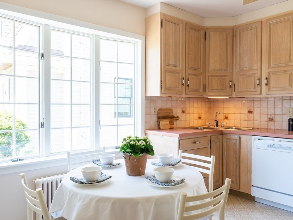 82 Oak Street Lexington, MA 02421 - Photo 12 of 31 a kitchen with a chair and potted plant