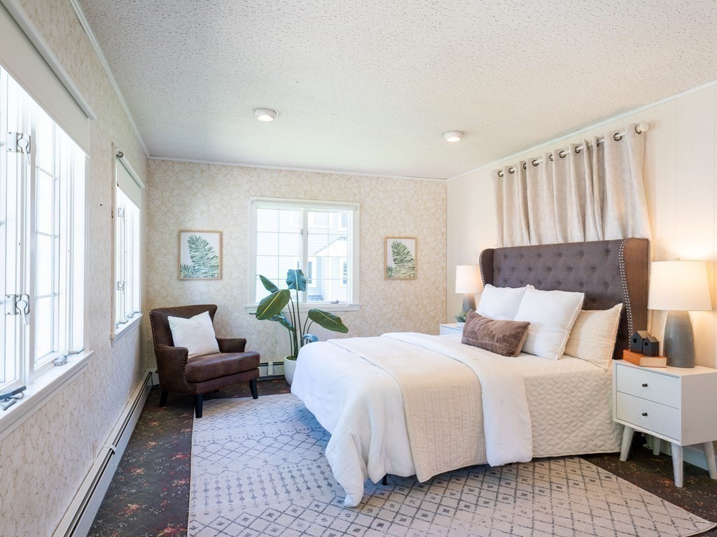 82 Oak Street Lexington, MA 02421 - Photo 13 of 31 a bedroom with a bed and a couch