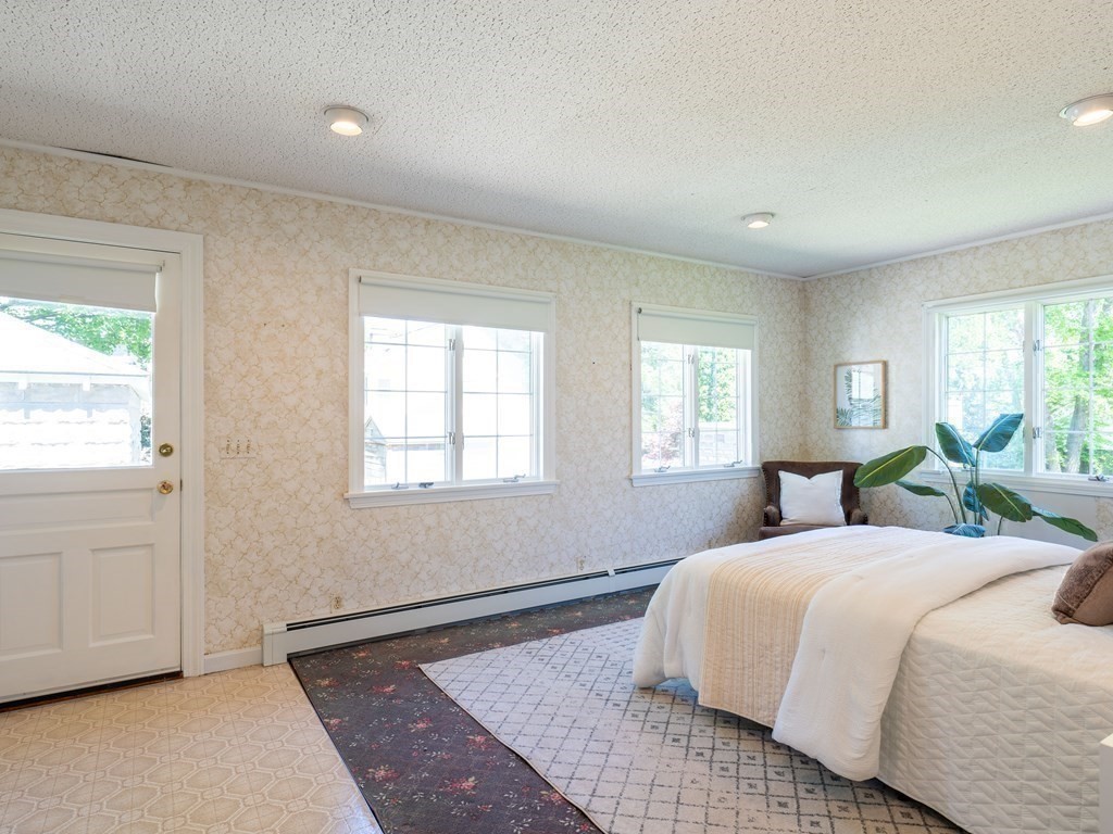 82 Oak Street Lexington, MA 02421 - Photo 14 of 31 a bedroom with a large bed and windows