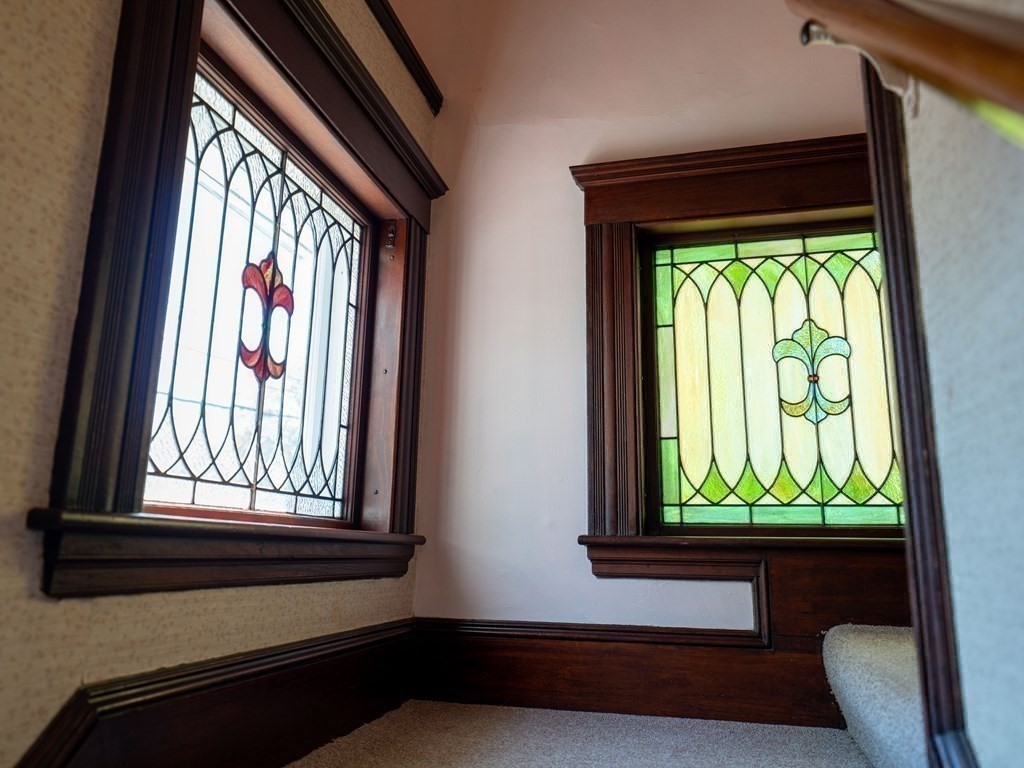 82 Oak Street Lexington, MA 02421 - Photo 19 of 31 a view of entry way with wooden floor and a window