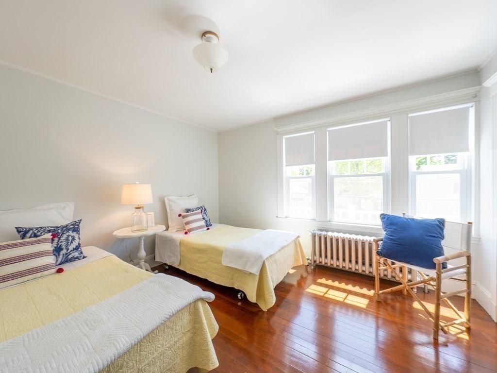 82 Oak Street Lexington, MA 02421 - Photo 20 of 31 a bedroom with two beds and wooden floor
