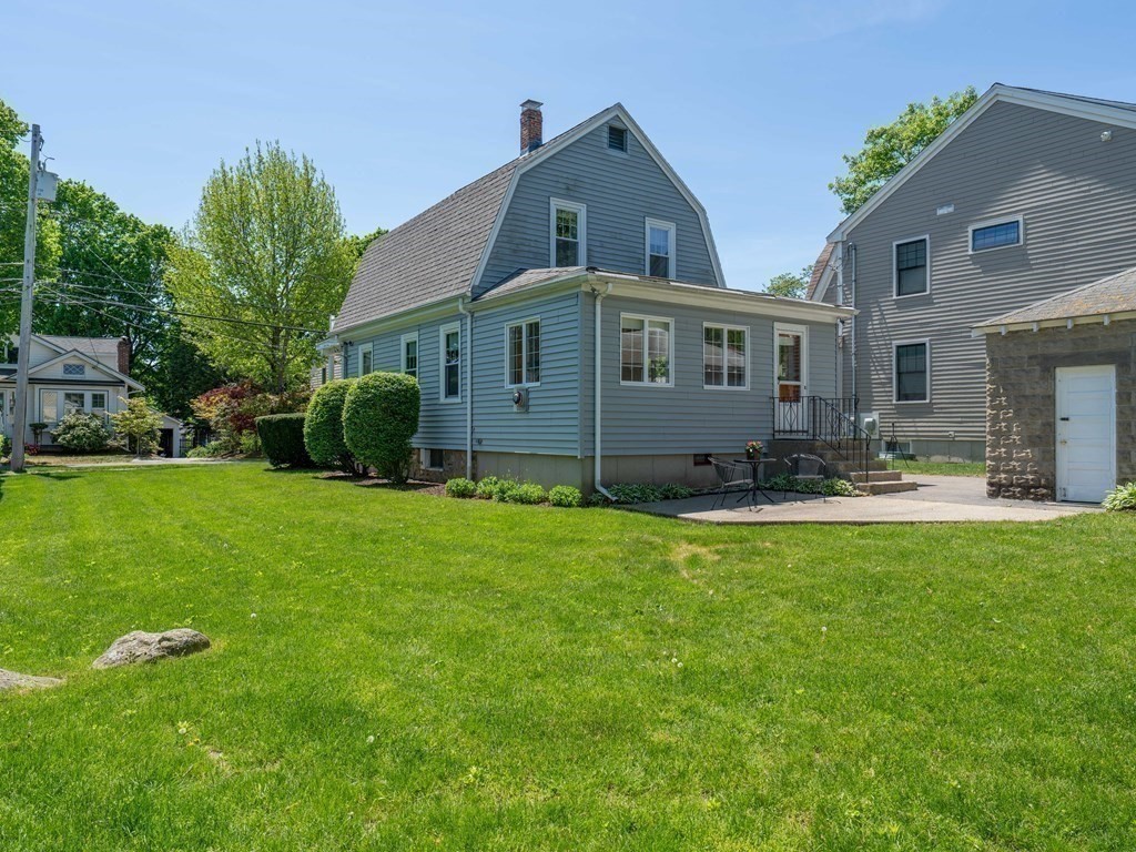 82 Oak Street Lexington, MA 02421 - Photo 24 of 31 a front view of house with yard and green space