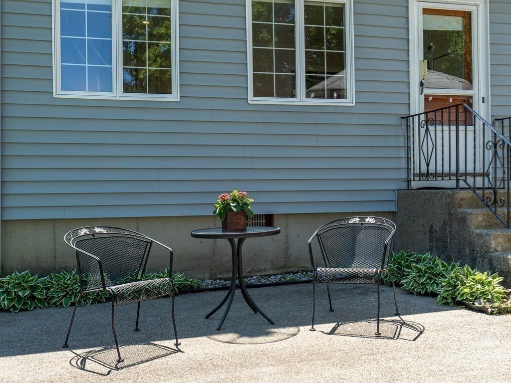 82 Oak Street Lexington, MA 02421 - Photo 25 of 31 a view of a chairs and table in the patio
