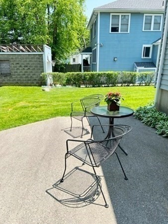 82 Oak Street Lexington, MA 02421 - Photo 26 of 31 a view of a swimming pool with lawn chairs and a big yard