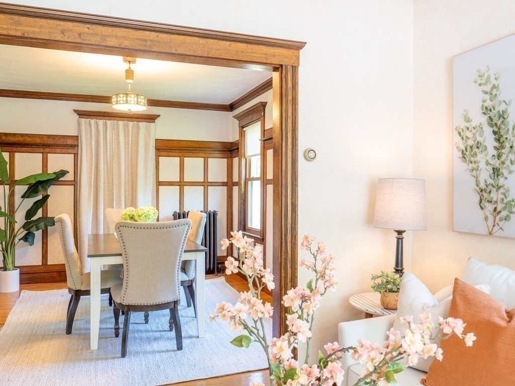 82 Oak Street Lexington, MA 02421 - Photo 7 of 31 a dining room with furniture a chandelier and wooden floor