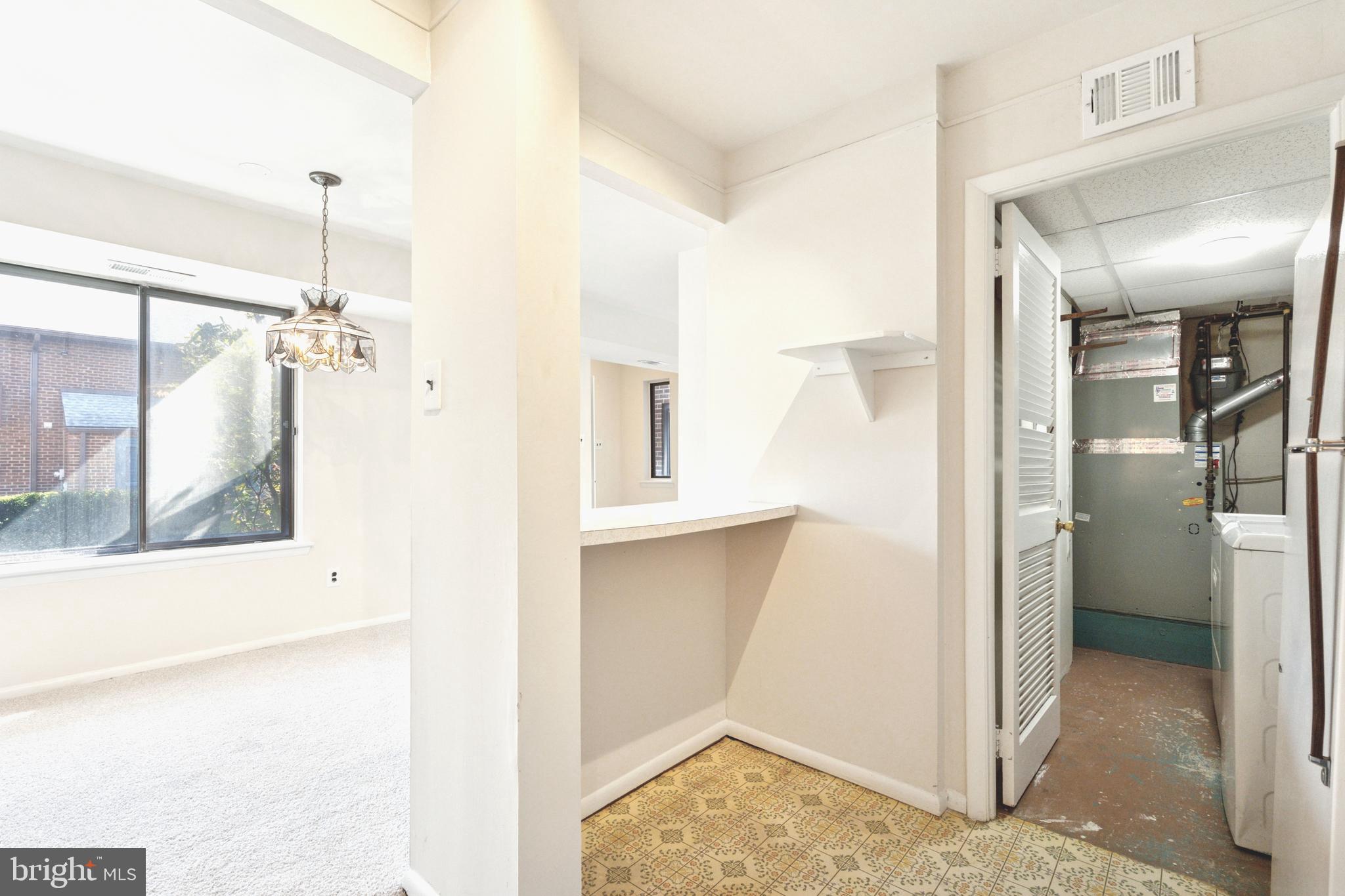 700 Ardmore Avenue, Unit 621 Ardmore, PA 19003 - Photo 11 of 37 a view of a hallway with a cabinet and a bathroom