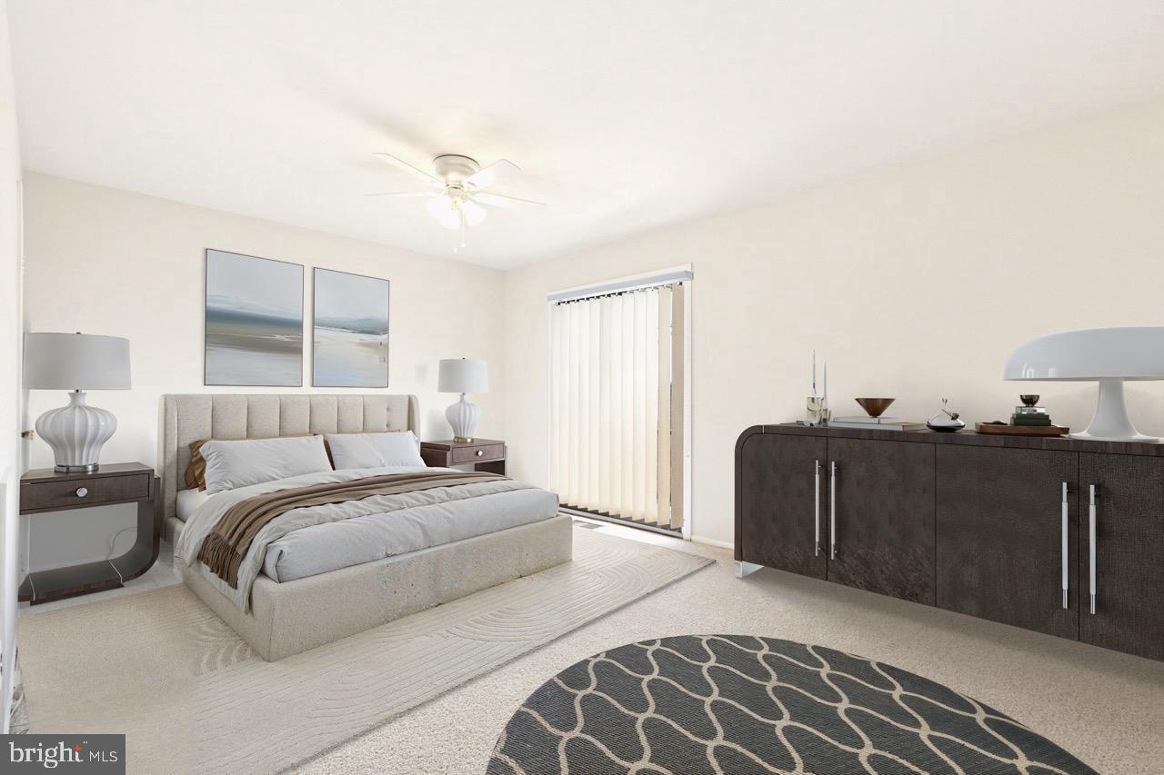 700 Ardmore Avenue, Unit 621 Ardmore, PA 19003 - Photo 17 of 37 a bedroom with a bed and wooden floor