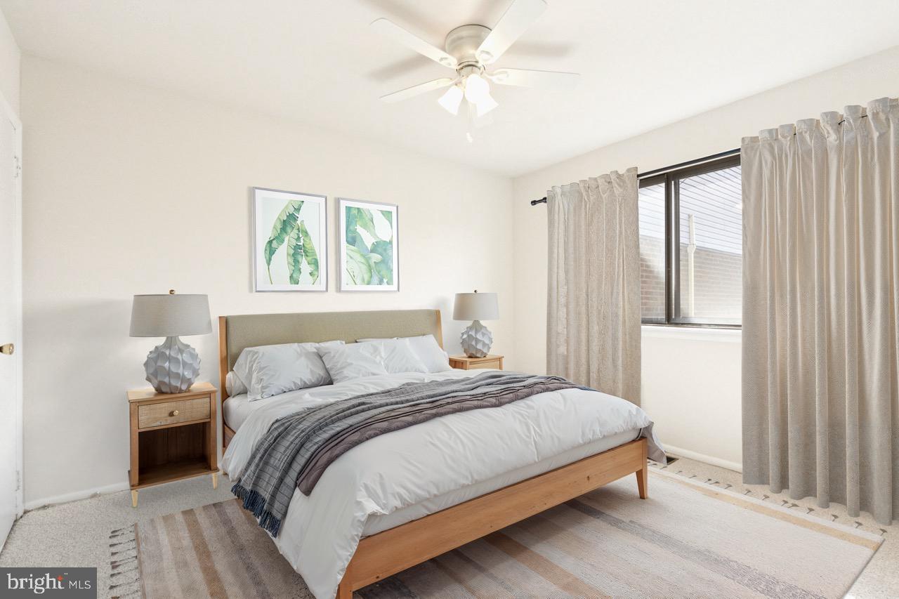 700 Ardmore Avenue, Unit 621 Ardmore, PA 19003 - Photo 21 of 37 a bedroom with a bed and a window